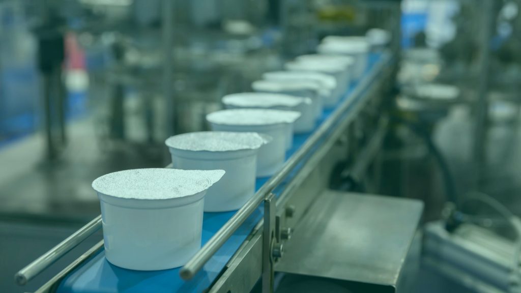 Yogurt pots on production chain